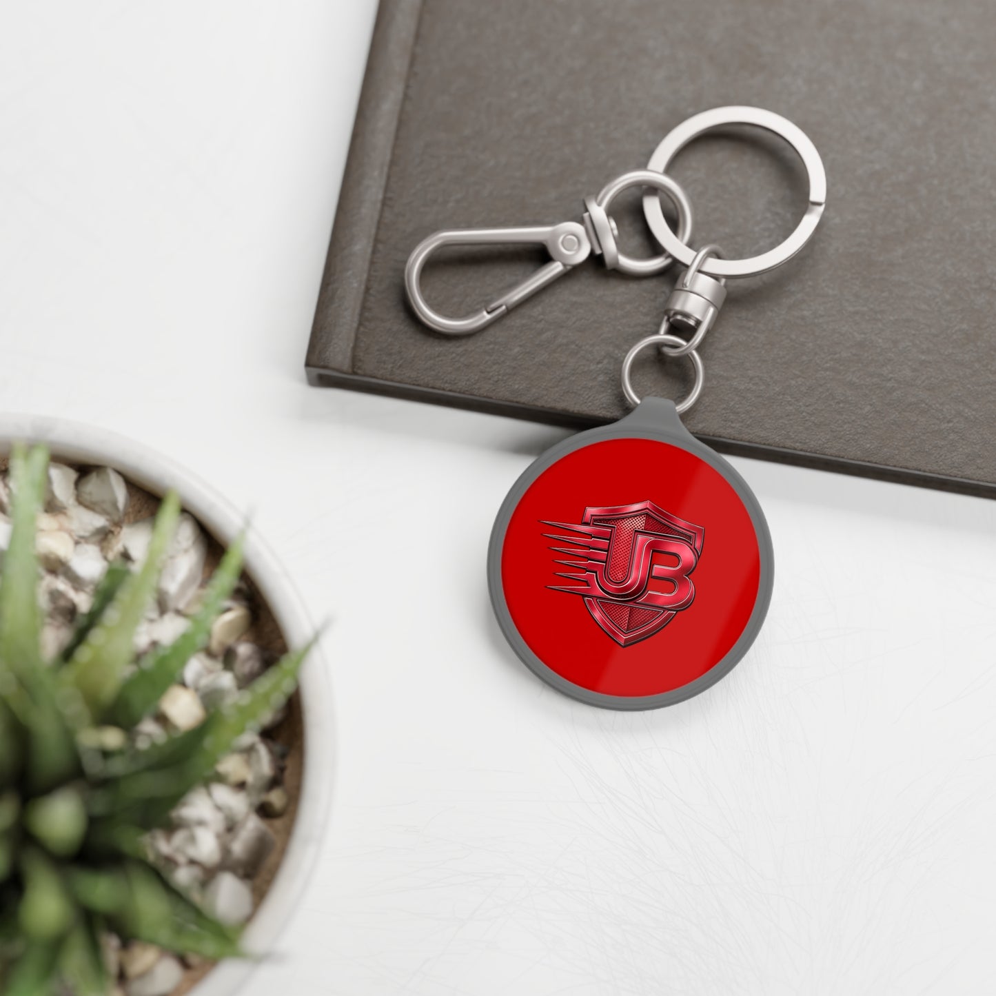Shielded JB Logo Keyring Tag — Red Metal Keychain with JB Emblem