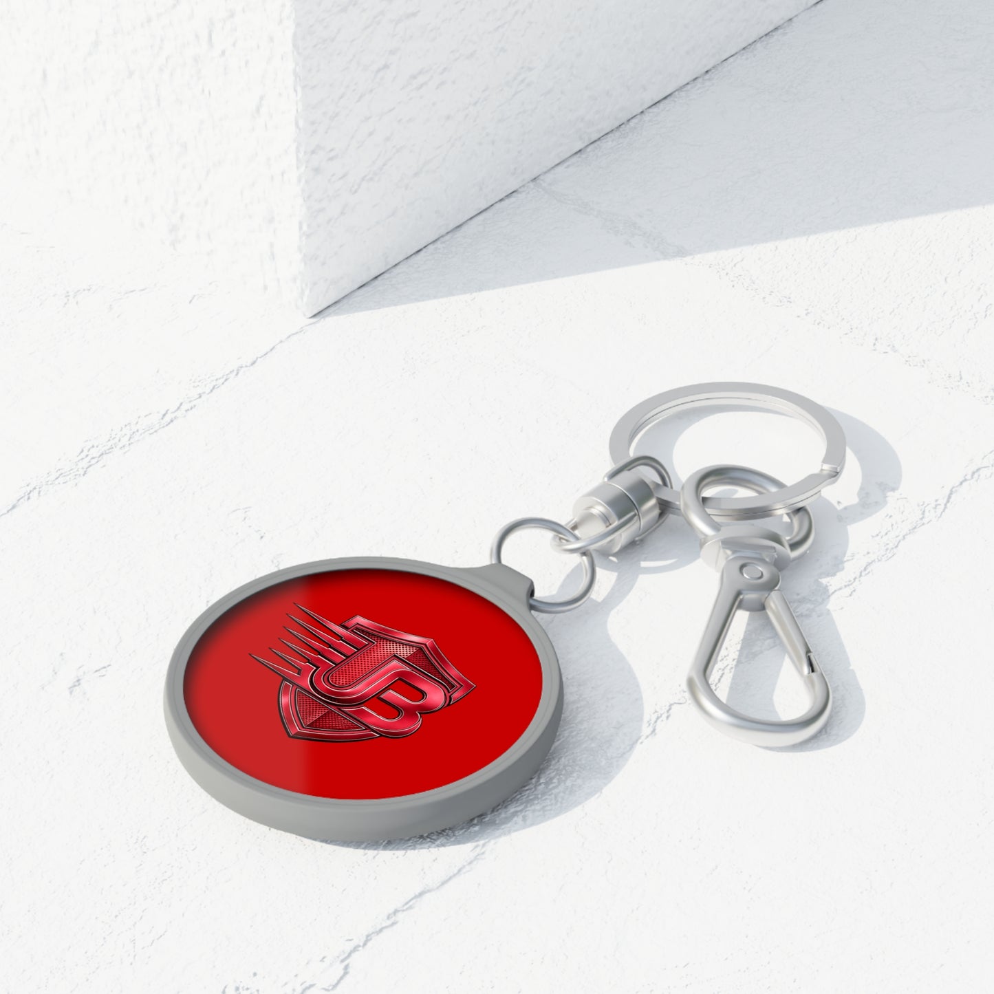 Shielded JB Logo Keyring Tag — Red Metal Keychain with JB Emblem